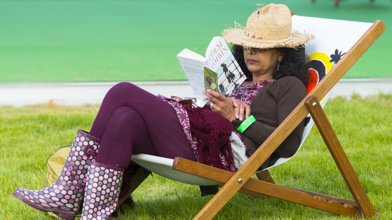 woman reading in deckchair at Hay Festival