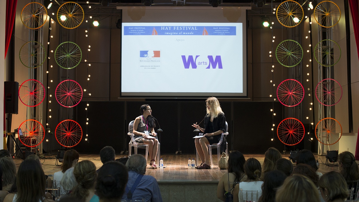 Two authors in discussion on stage