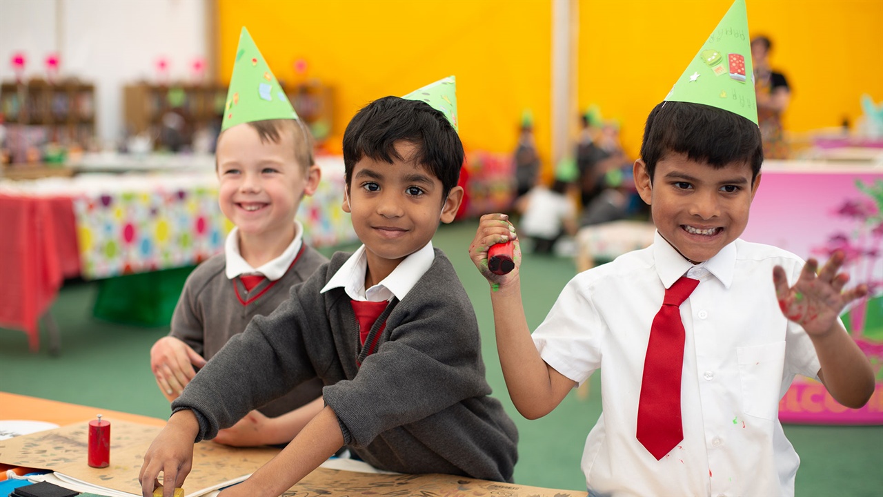 Primary age children enjoying crafting activities