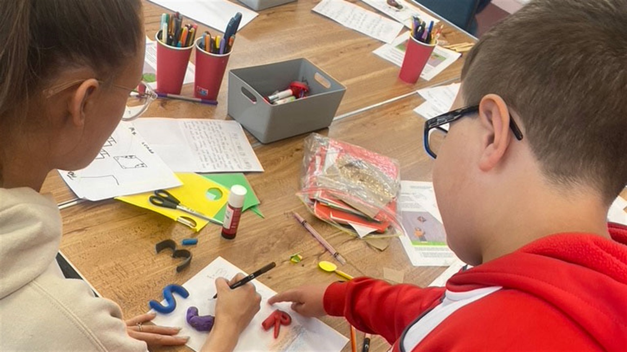 Children participating in a Hay Festival Education outreach group