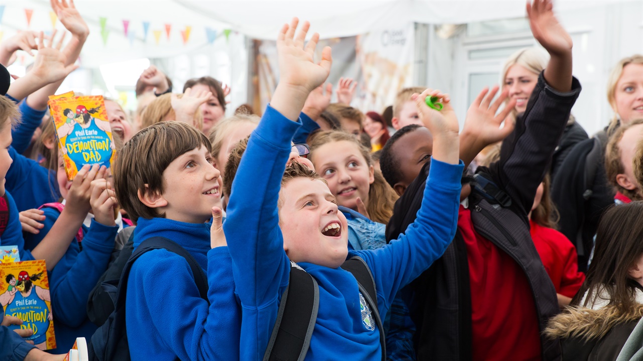 Young readers on Hay Festival sign