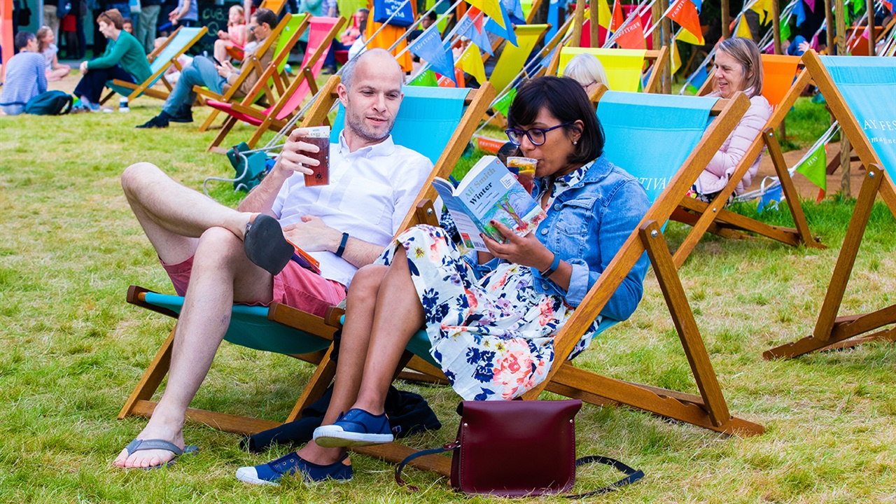 Festival-goers in deckchairs
