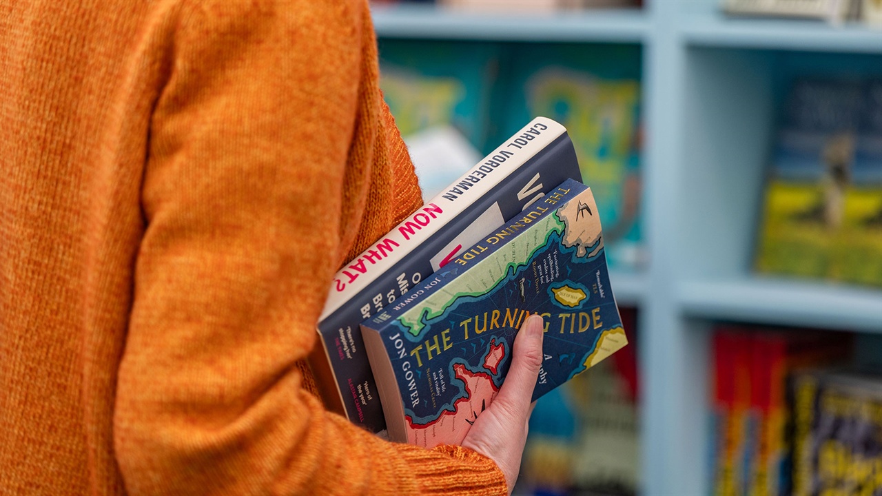 Reader choosing books in a bookshop