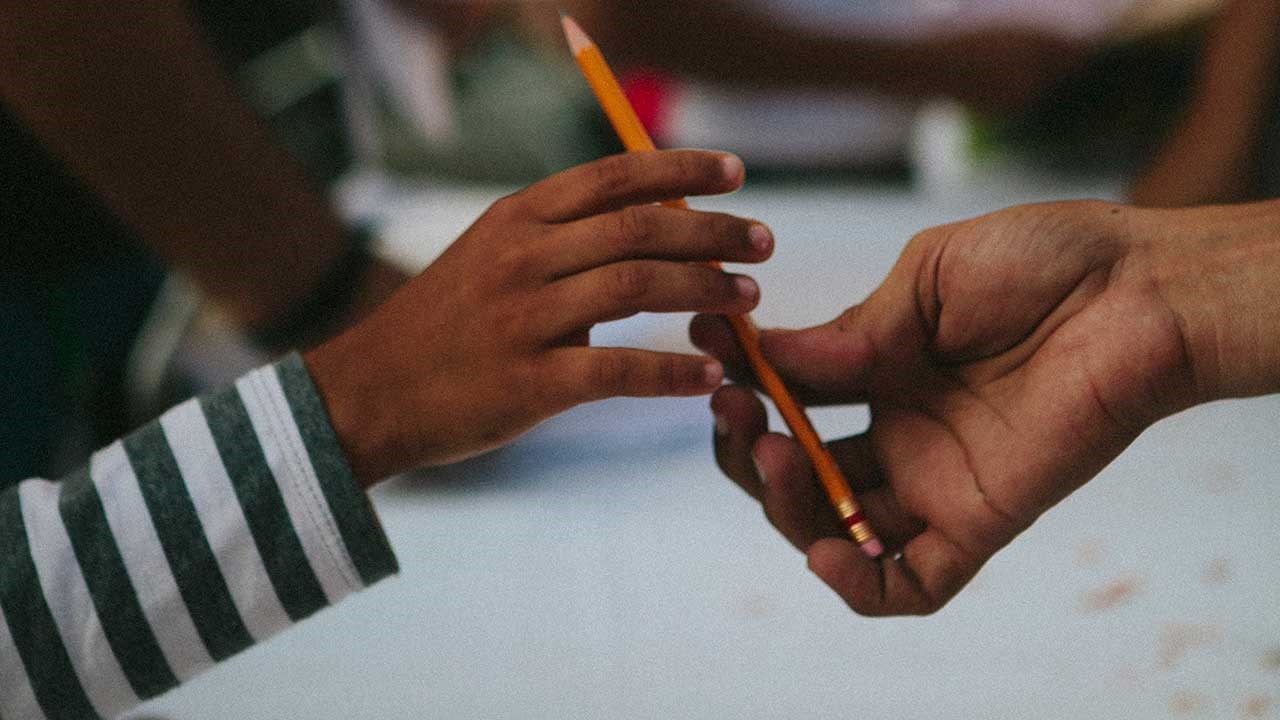 Handing over a pencil