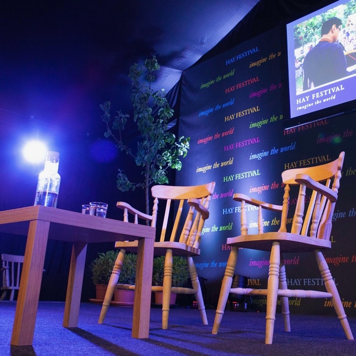 Hay Festival stage with chairs and screen