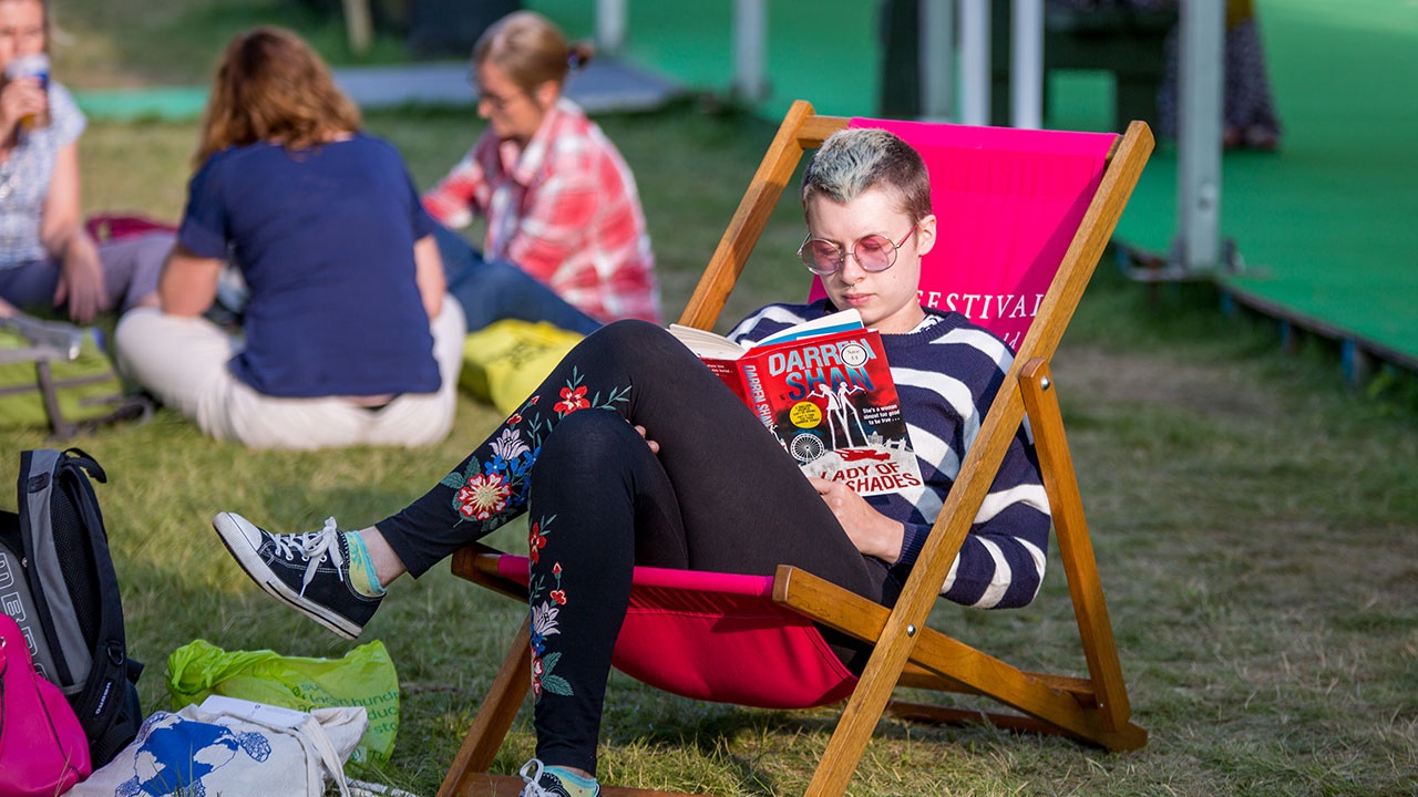 Student reading at Hay Festival