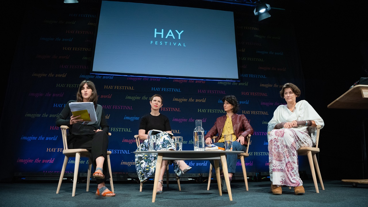 Two authors in discussion on stage